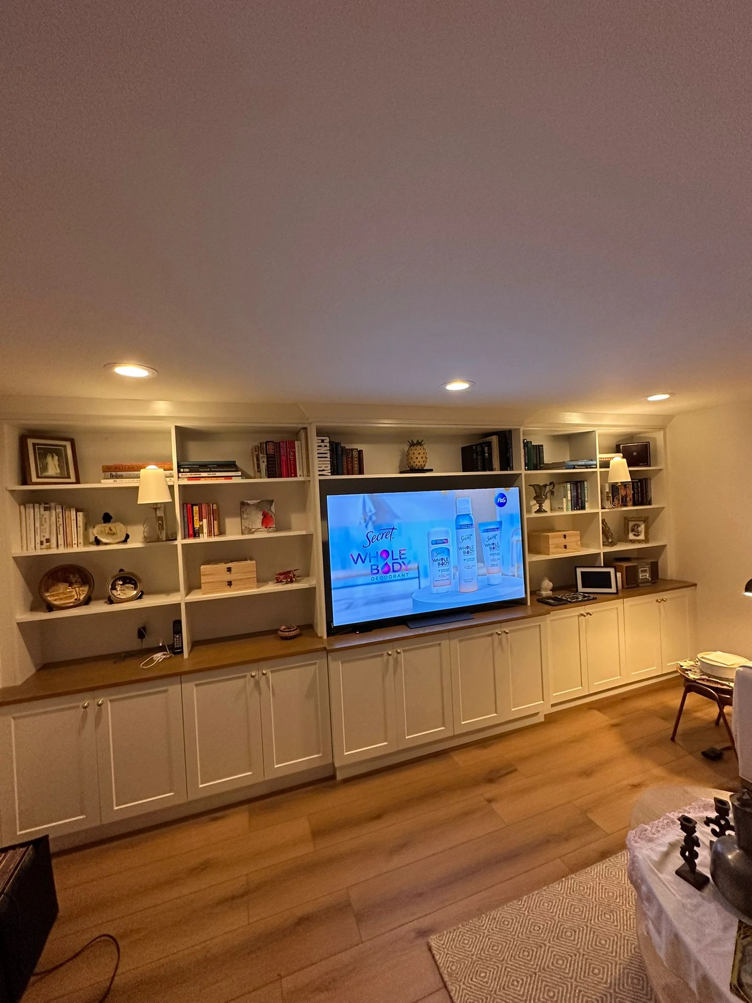 Custom built-in entertainment wall unit with shelving by Hive Interior