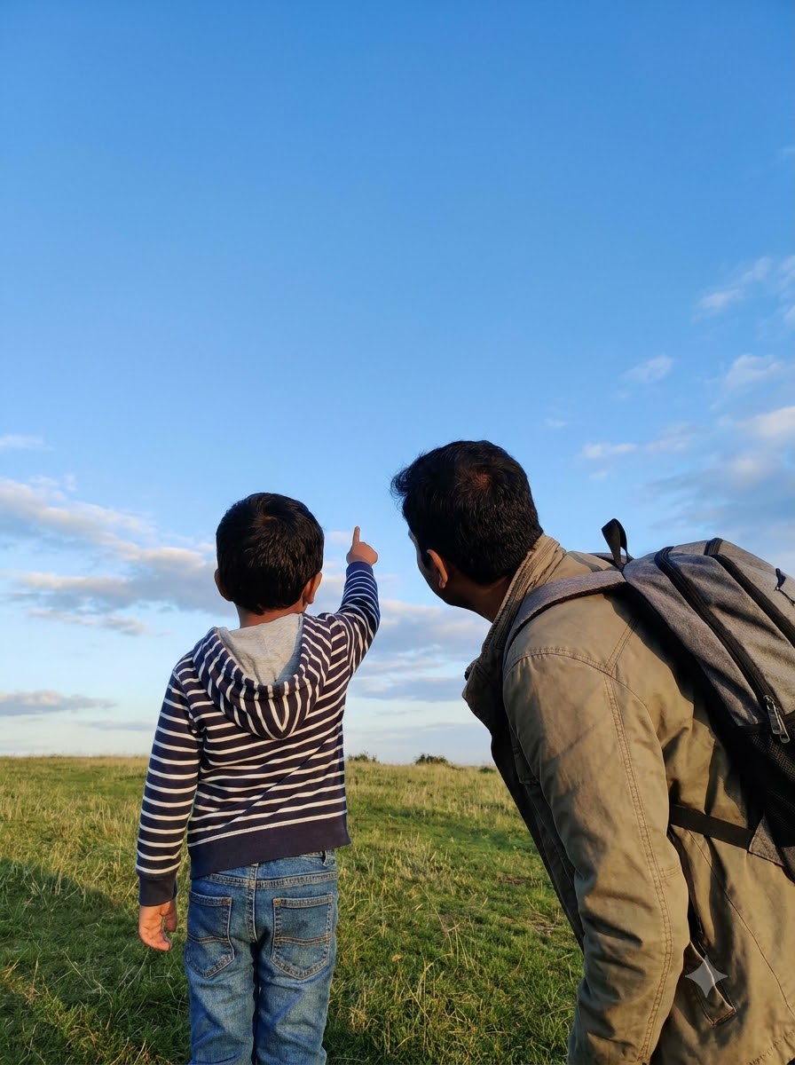 A child pointing at the sky, asking a parent a curious question outdoors