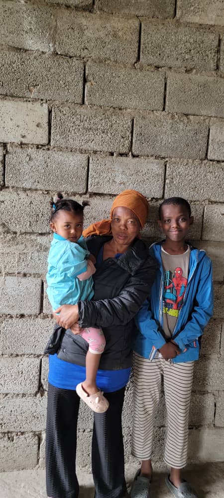 A caregiver and children at our home.