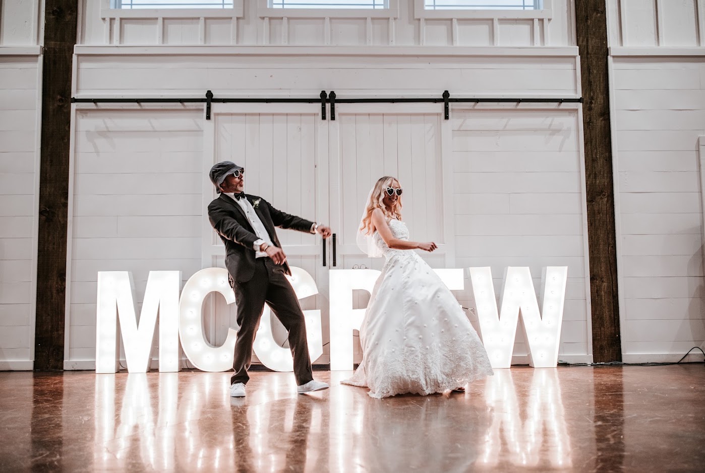 Groom performing for guests with wedding party lined up