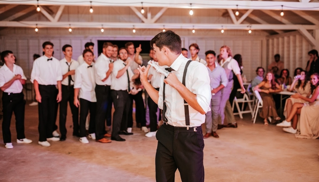 Bride and groom mid-dip on the reception dance floor