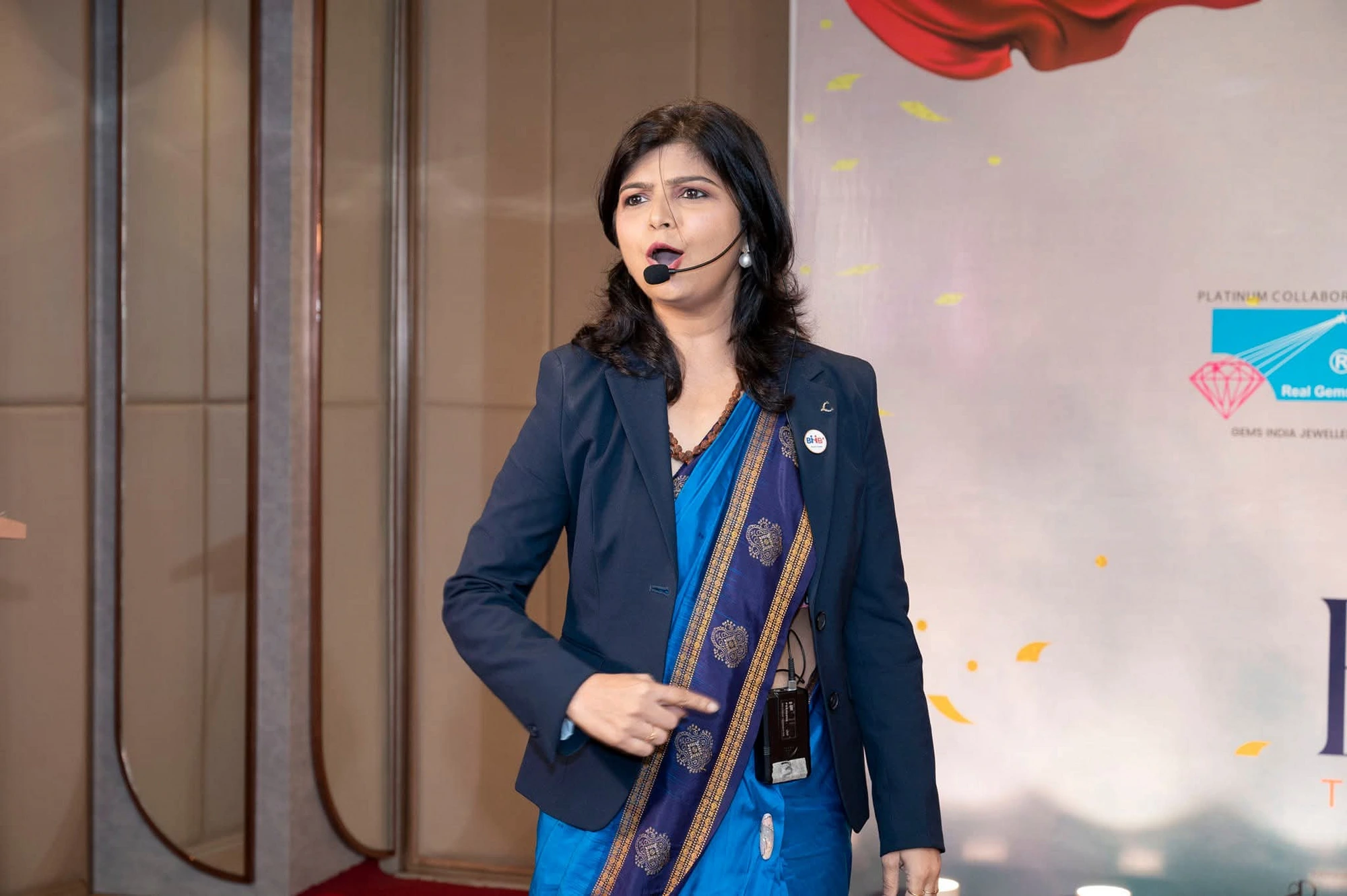 Archanaa Siingh — Founder & Mentor, speaking on stage
