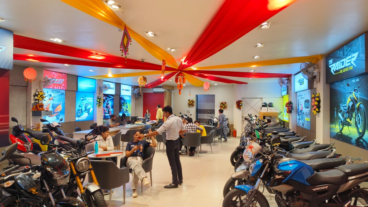 Motorcycle showroom decorated with red and yellow ceiling drapes