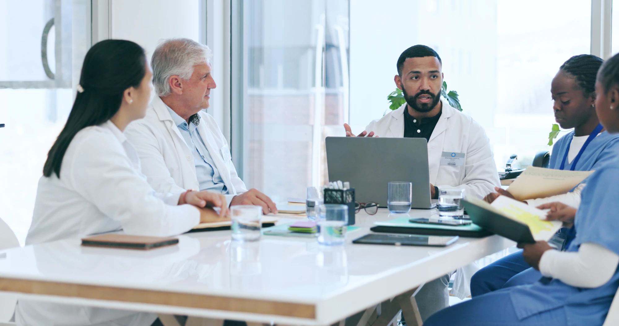 Healthcare professionals in a leadership meeting
