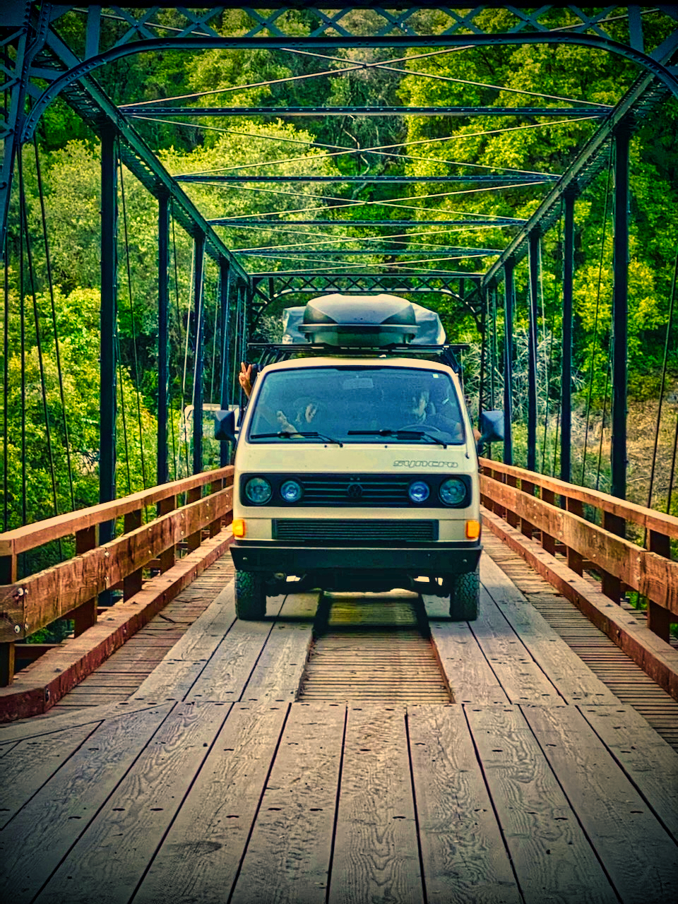 Head-on, crossing a steel truss bridge