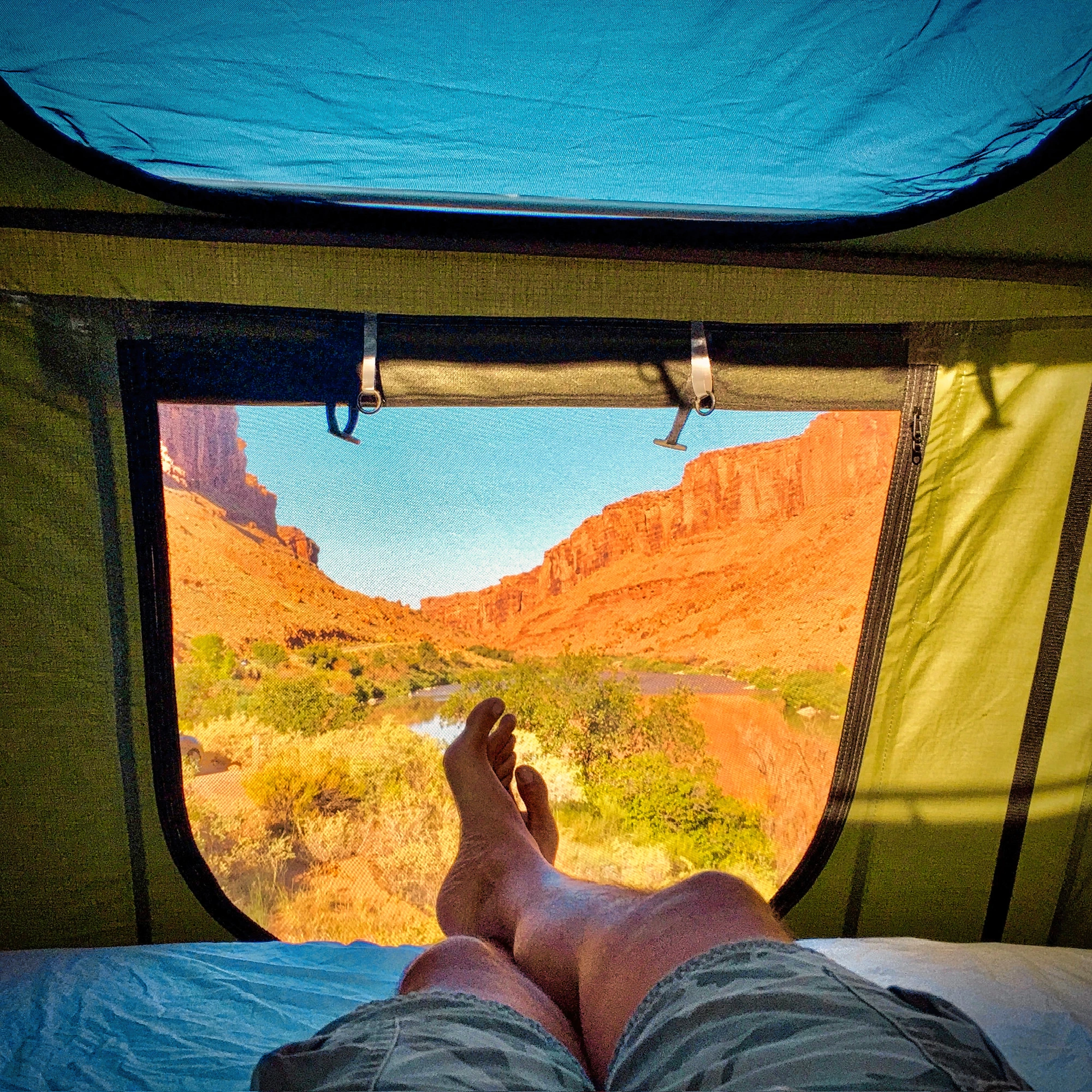 Morning view from the rooftop tent over Moab red rock