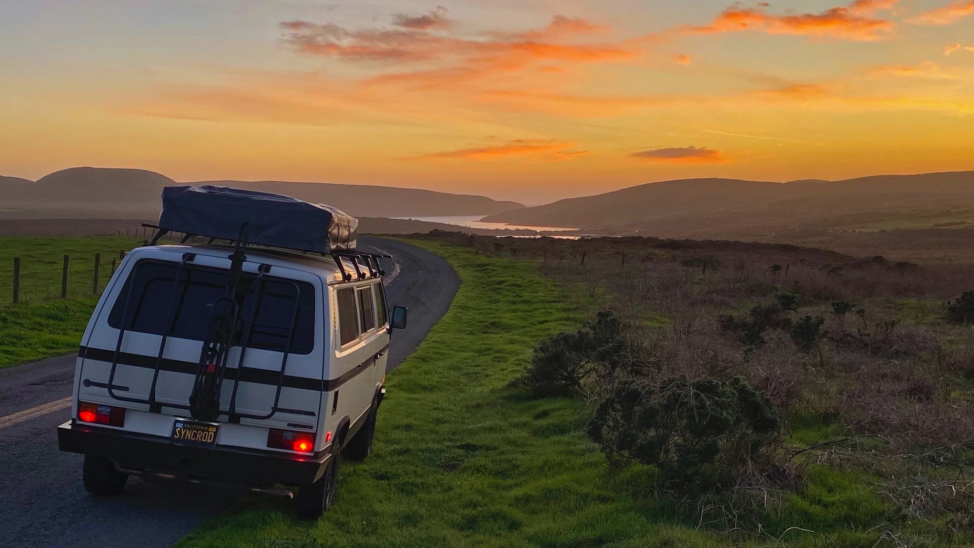 Van at rest under a coastal sunset