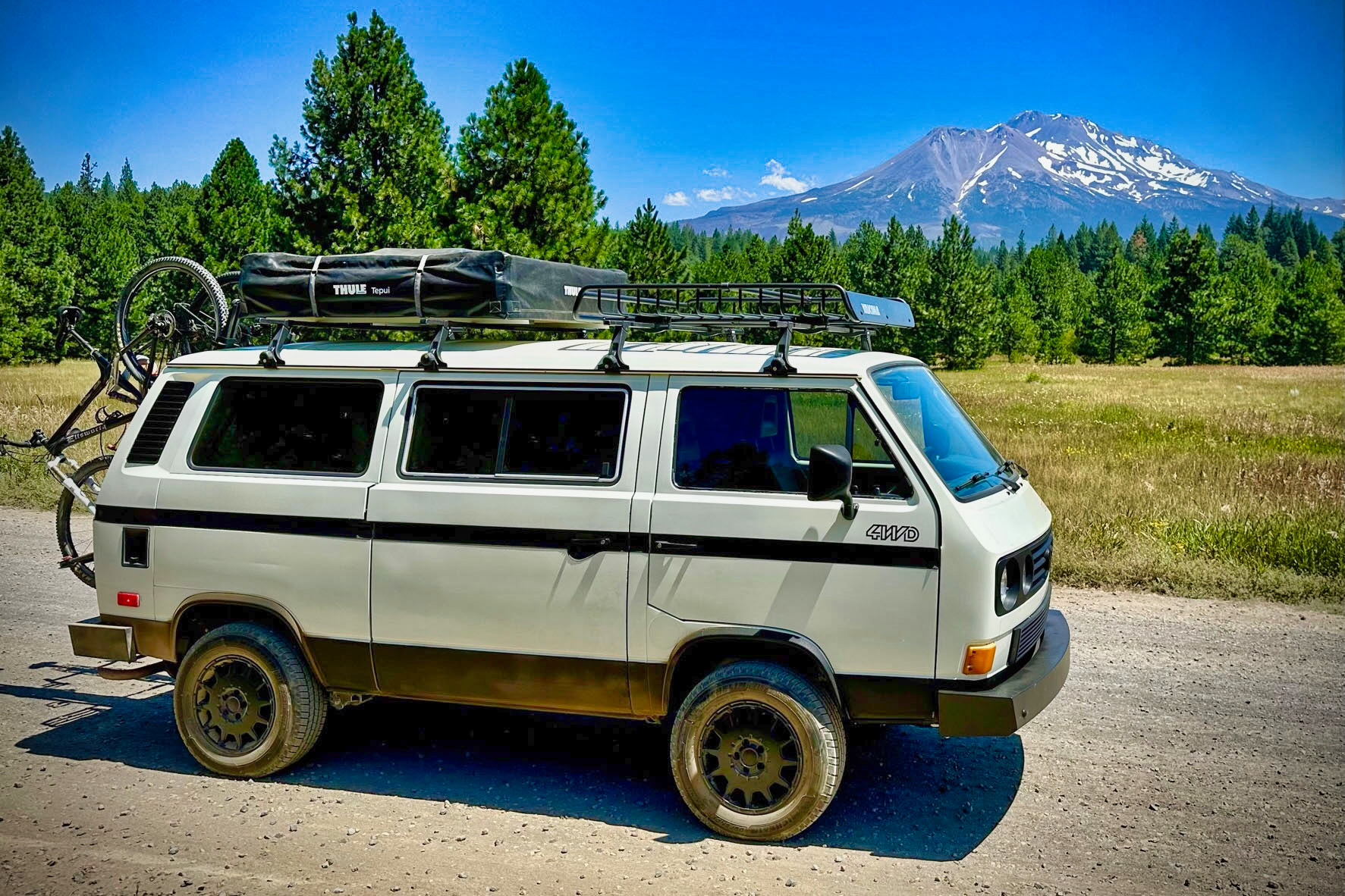 Syncro with full expedition kit before a mountain backdrop